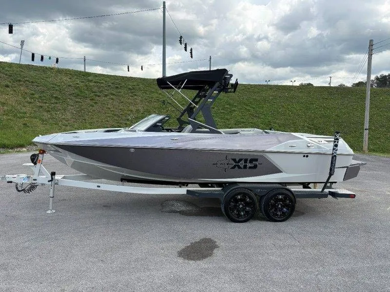 Slide: The Image of 2017 Axis T23 boat on trailer, cloudy sky. - 15