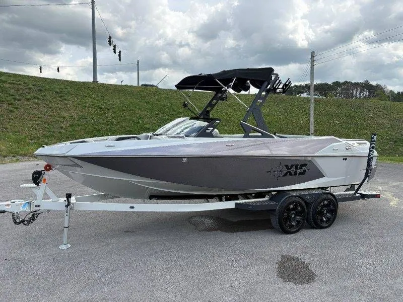 Slide: The Image of 2017 Axis T23 boat on trailer, gray hull, black canopy. - 19