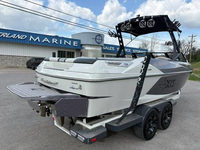 Slide: The Image of 2017 Axis T23 boat on trailer outside marine store. - 20