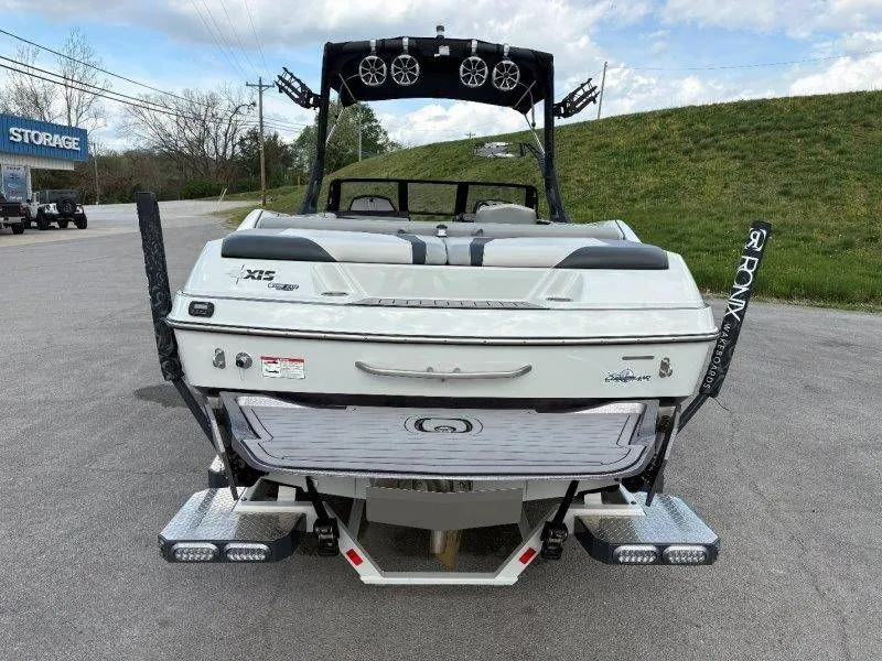 Slide: The Image of Rear view of a 2017 Axis T23 boat in a parking lot. - 21