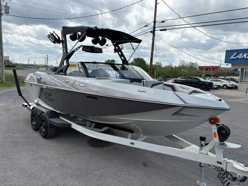 Slide: The Image of 2017 Axis T23 boat on trailer, cloudy sky. - 23