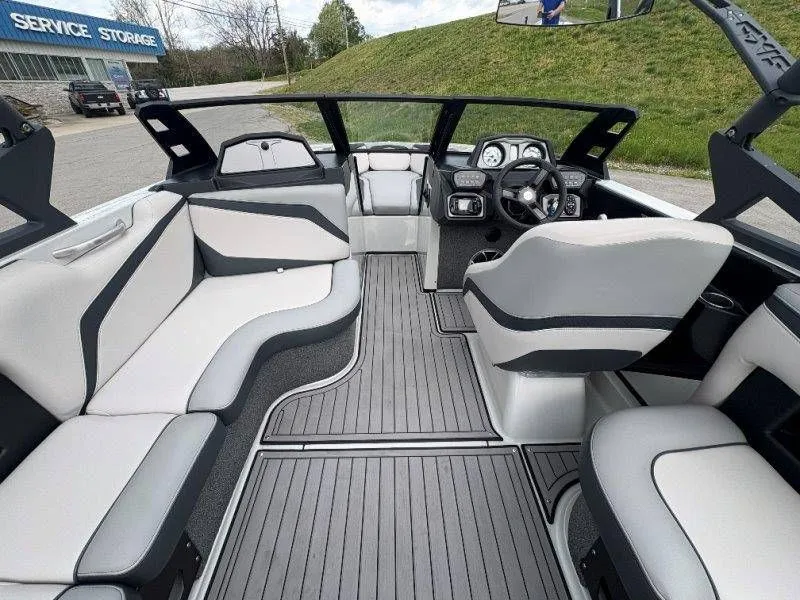 Slide: The Image of Interior of a 2017 Axis T23 boat with gray seating. - 26