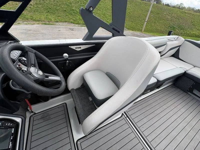 Slide: The Image of Interior of a 2017 Axis T23 boat with steering wheel and seat. - 35