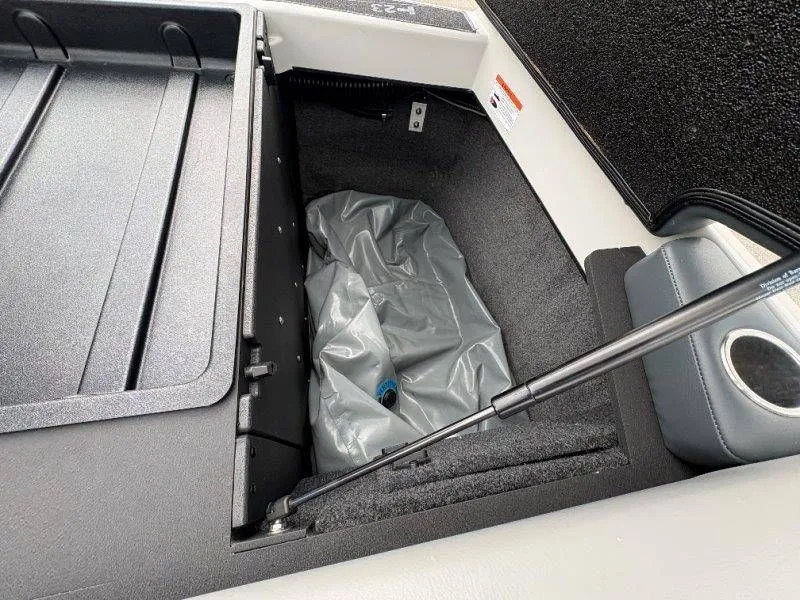 Slide: The Image of Storage compartment in 2017 Axis T23 boat with gray cover. - 38