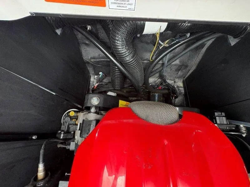 Slide: The Image of Engine compartment of a 2017 Axis T23 with red covers. - 43