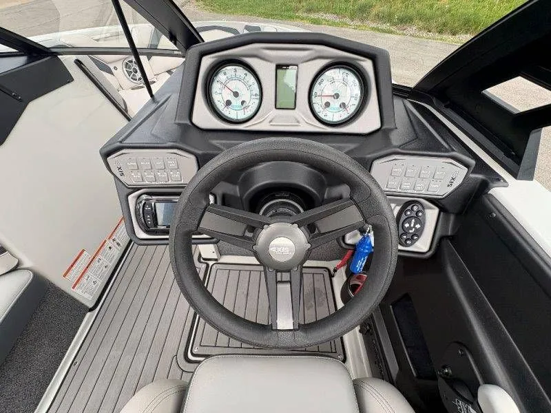 Slide: The Image of Steering wheel and dashboard of a 2017 Axis T23 boat. - 44
