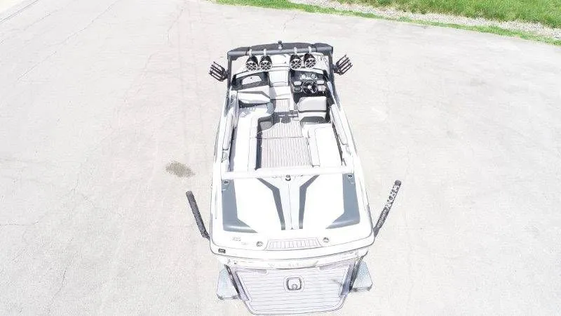 Slide: The Image of Aerial view of a 2017 Axis T23 boat on pavement. - 7