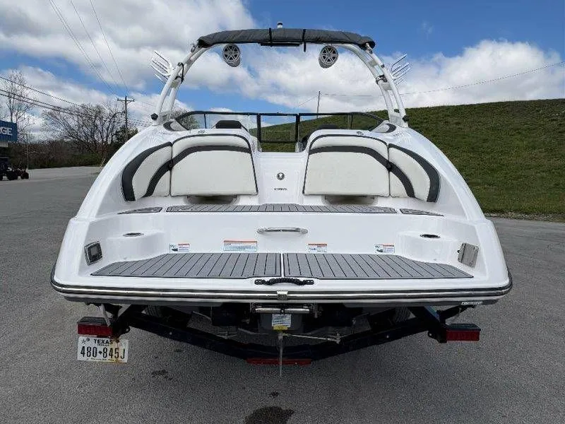 Slide: The Image of Rear view of a 2016 Yamaha AR240 boat on a trailer. - 13