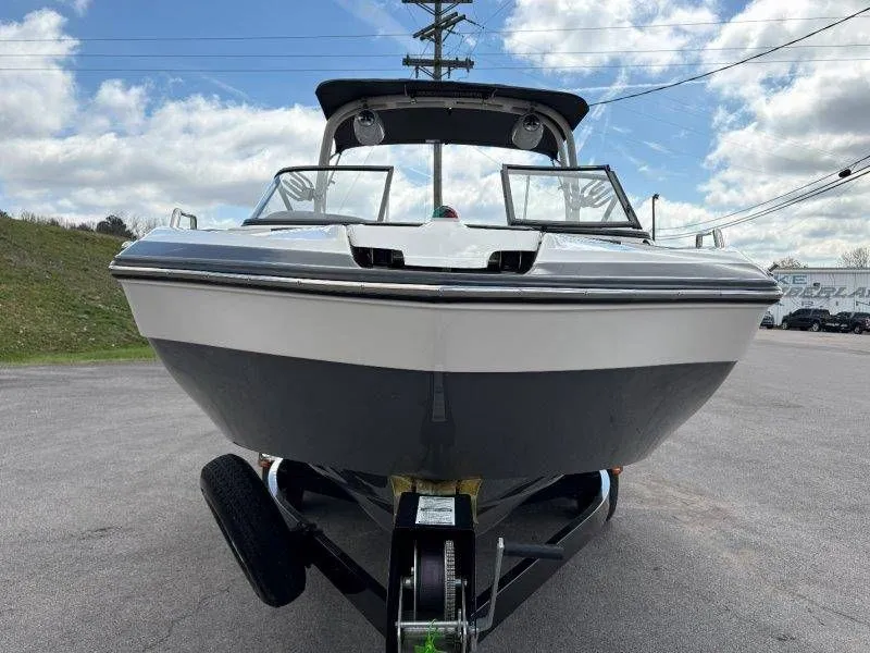 Slide: The Image of 2016 Yamaha Boats AR240 on trailer, front view under blue sky. - 16