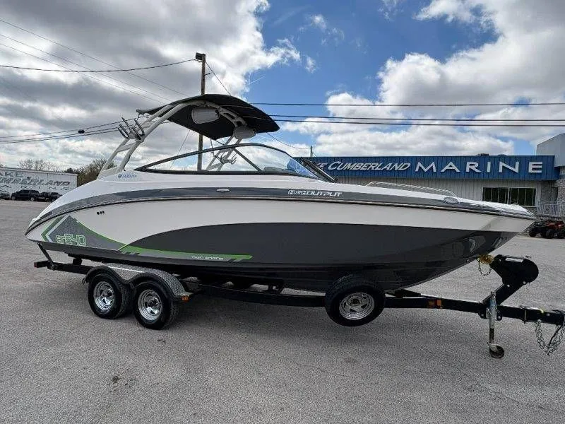Slide: The Image of 2016 Yamaha AR240 boat on trailer in front of marine shop. - 17
