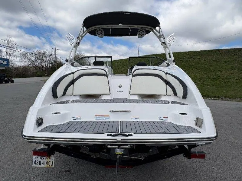 Slide: The Image of Rear view of a 2016 Yamaha AR240 boat on a trailer. - 23