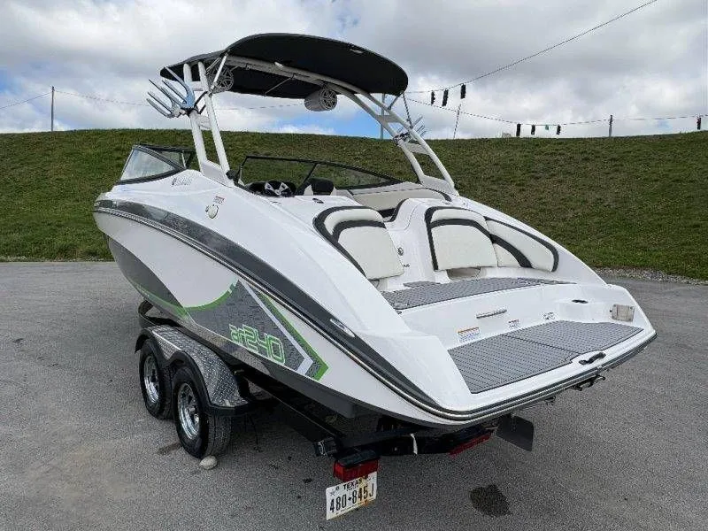 Slide: The Image of 2016 Yamaha AR240 boat on trailer, white with green accents. - 27