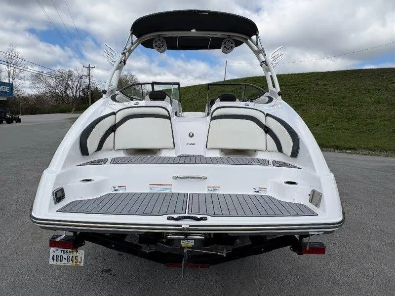Slide: The Image of Rear view of a 2016 Yamaha AR240 boat on a trailer. - 29