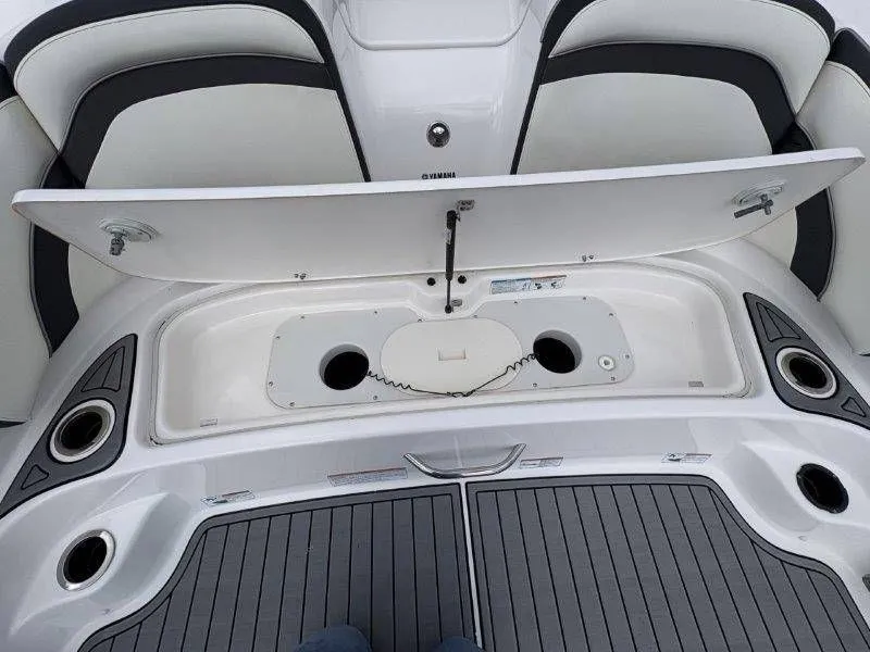 Slide: The Image of 2016 Yamaha AR240 boat with open storage compartment lid. - 31