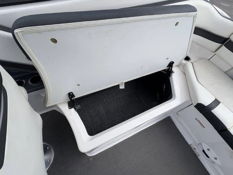 Slide: The Image of 2016 Yamaha AR240 boat with open storage compartment. - 34
