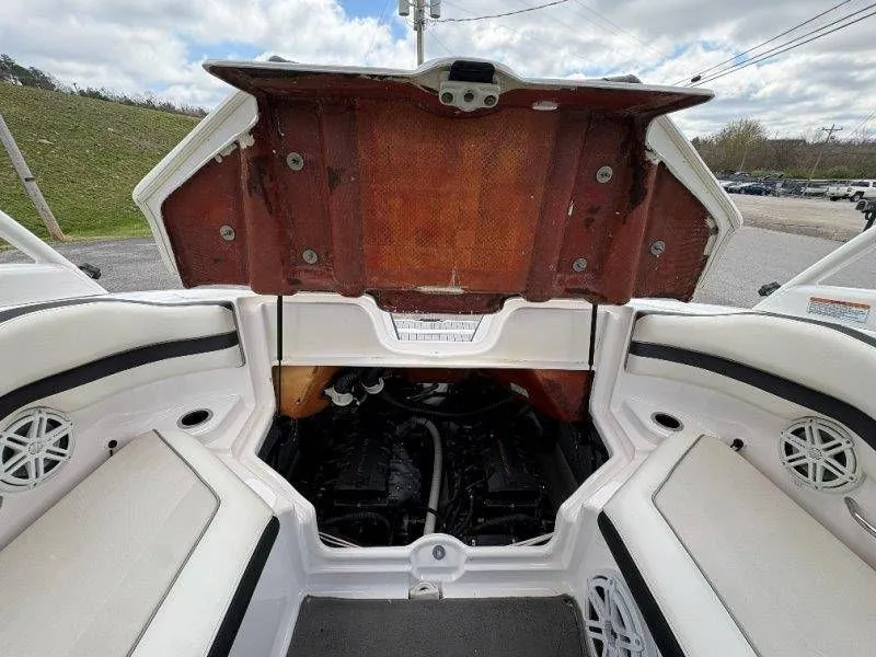 Slide: The Image of Engine compartment of a 2016 Yamaha AR240 boat with open hatch. - 37