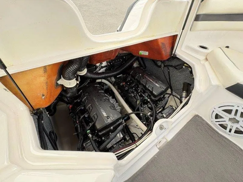 Slide: The Image of Engine compartment of a 2016 Yamaha AR240 boat, showing engines and wiring. - 43