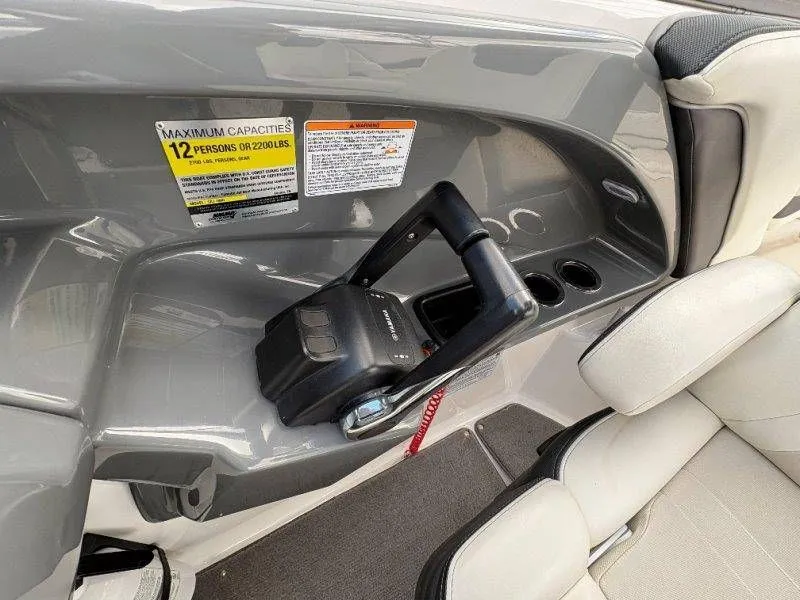 Slide: The Image of Interior of a 2016 Yamaha AR240 boat with control console. - 47