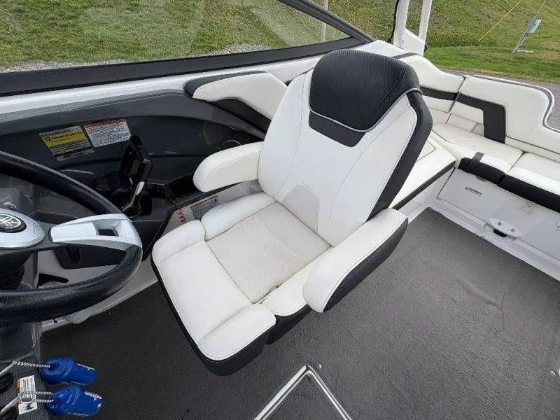 Slide: The Image of Interior of a 2016 Yamaha AR240 boat with white seating. - 49