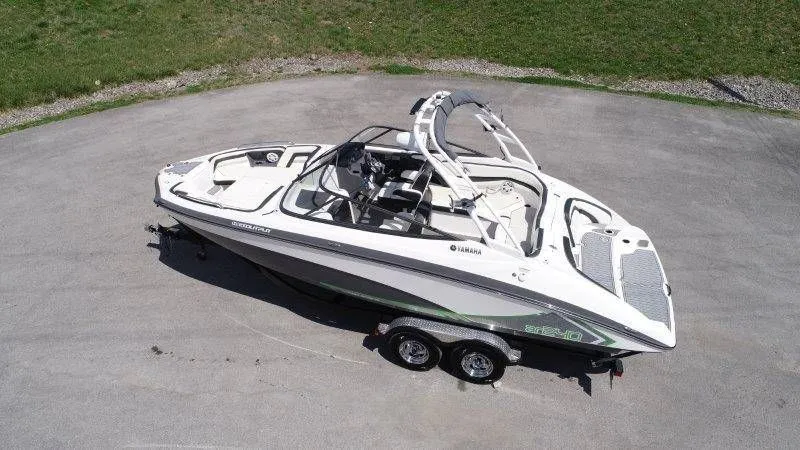 Slide: The Image of Aerial view of a 2016 Yamaha AR240 boat on a trailer. - 5