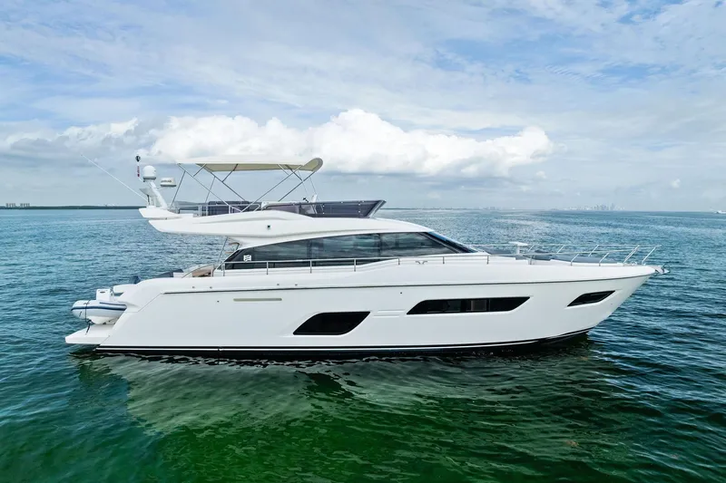 The Image of 2018 Ferretti Yachts 550 cruising on calm ocean waters under a clear sky. - 11