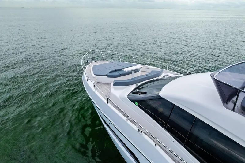 Slide: The Image of 2018 Ferretti Yachts 550 cruising on calm waters, showcasing sleek design and luxury features. - 24