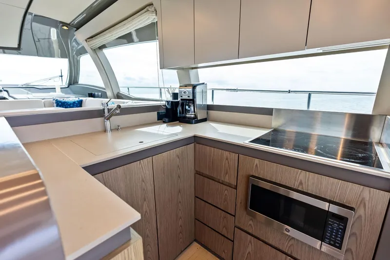 Slide: The Image of Modern kitchen interior on 2018 Ferretti Yachts 550, featuring sleek cabinetry and appliances. - 48