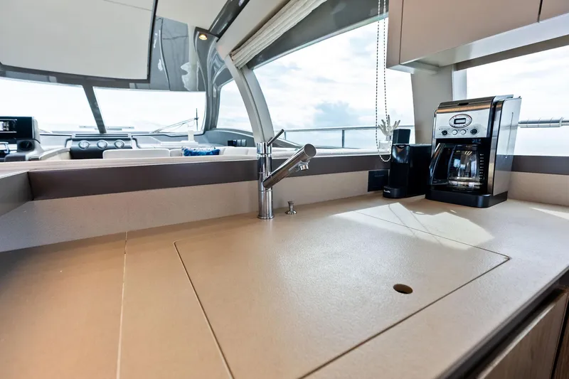 Slide: The Image of Luxurious kitchen area on a 2018 Ferretti Yachts 550 with modern amenities. - 49