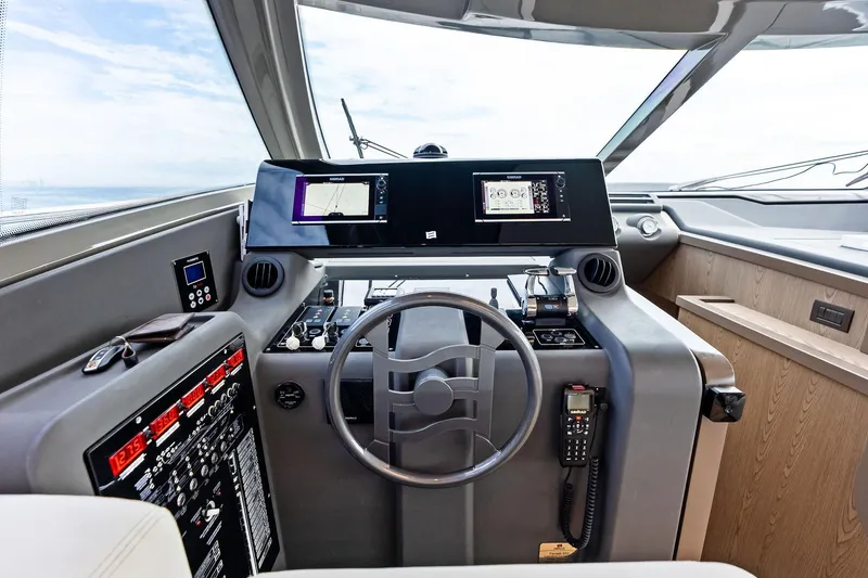 Slide: The Image of Cockpit of 2018 Ferretti Yachts 550 with modern navigation equipment and controls. - 59