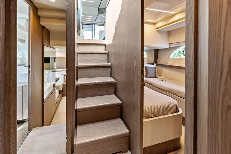 Slide: The Image of Luxurious interior of 2018 Ferretti Yachts 550, featuring elegant wood finishes and cozy cabin space. - 62