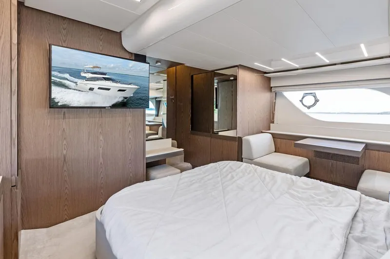 Slide: The Image of Luxurious interior of 2018 Ferretti Yachts 550 with modern furnishings and large window view. - 65