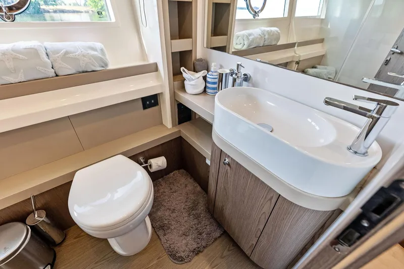 Slide: The Image of Luxurious bathroom in 2018 Ferretti Yachts 550, featuring modern sink and toilet. - 74