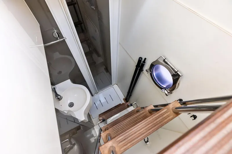 Slide: The Image of Compact bathroom in 2018 Ferretti Yachts 550, featuring a sink and porthole window. - 75