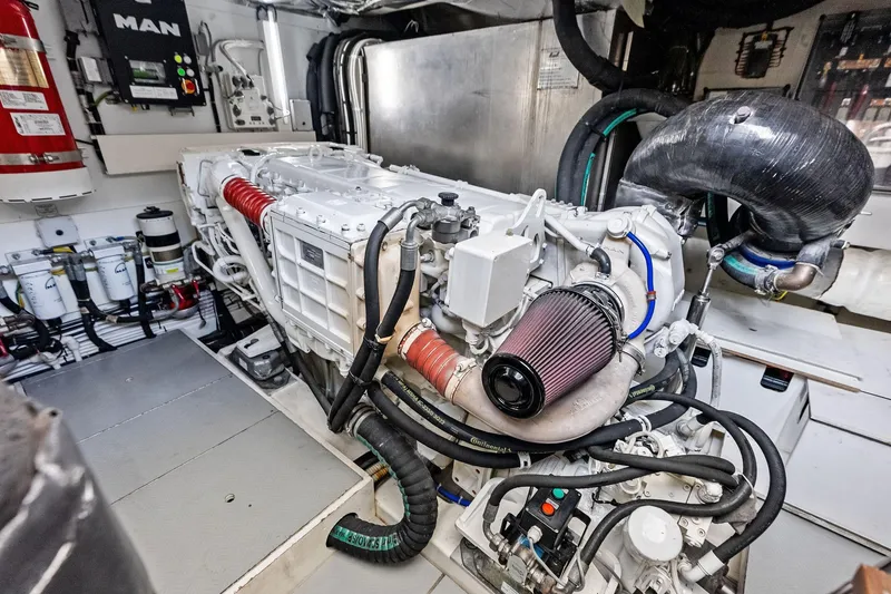 Slide: The Image of Engine room of a 2018 Ferretti Yachts 550, showcasing advanced machinery and components. - 81