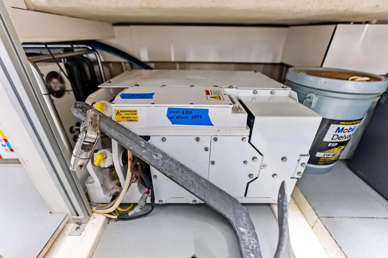 Slide: The Image of Engine room of 2018 Ferretti Yachts 550 with equipment and maintenance tools. - 82