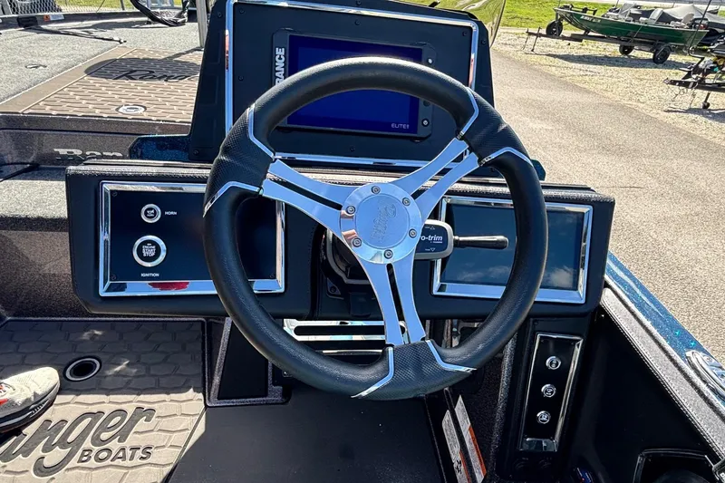 Slide: The Image of 2025 Ranger Z520R boat dashboard with steering wheel and control panel. - 10