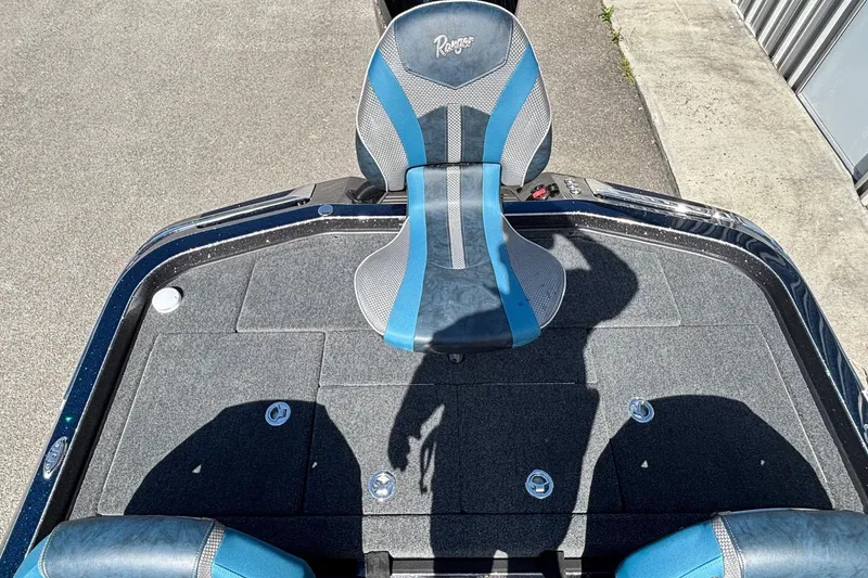 Slide: The Image of Ranger Z520R 2025 boat seat and deck in blue and gray. - 11