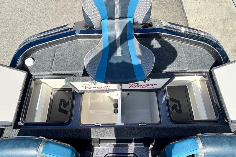 Slide: The Image of 2025 Ranger Z520R boat interior with storage compartments and seating. - 12