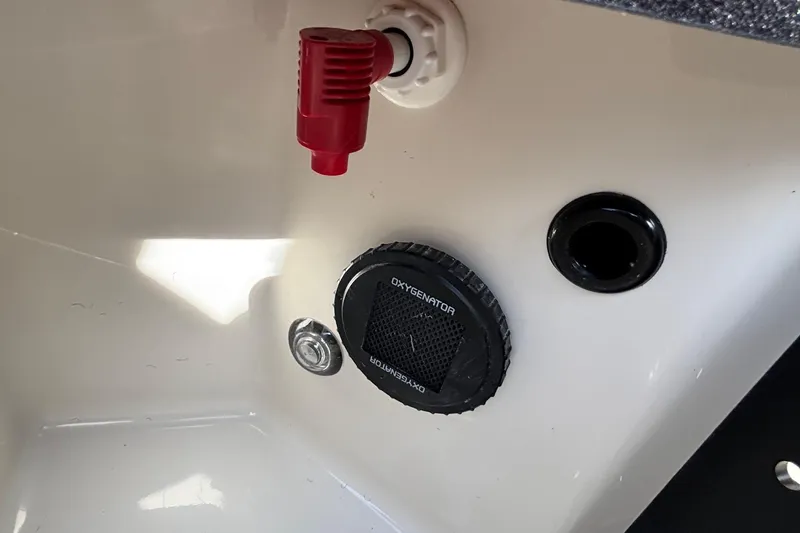 Slide: The Image of 2025 Ranger Z520R boat interior with oxygenator and red valve. - 13