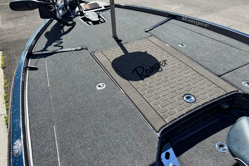 Slide: The Image of 2025 Ranger Z520R boat deck with textured flooring and control panel. - 4