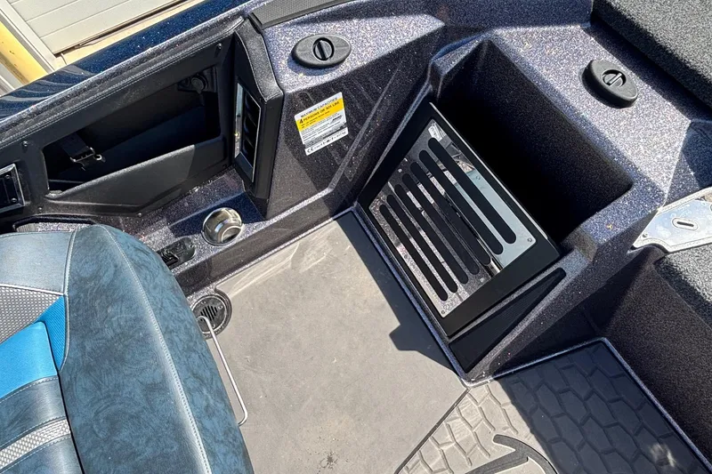 Slide: The Image of Interior view of a 2025 Ranger Z520R boat, showcasing seating and storage compartments. - 8