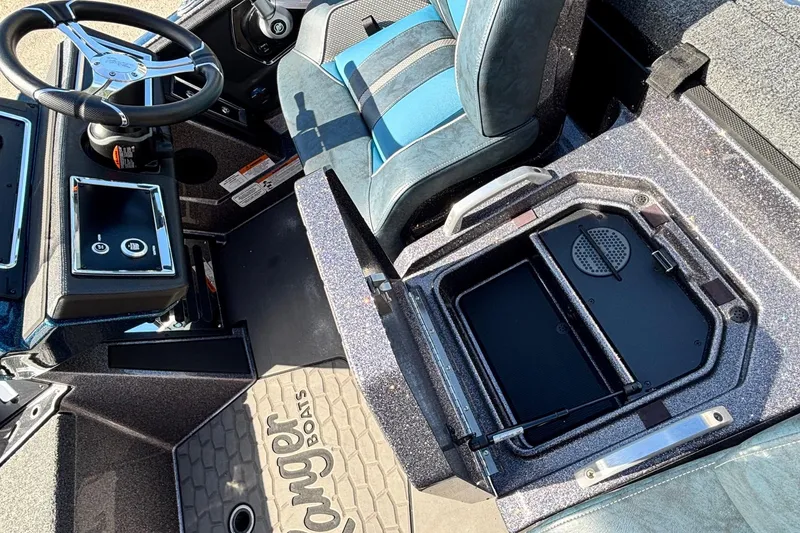 Slide: The Image of Interior of 2025 Ranger Z520R boat showing steering wheel and storage compartment. - 9