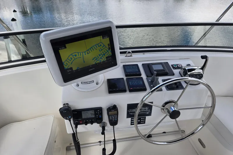 Slide: The Image of Helm of 2009 American Tug 34 Rare Flybridge Model with navigation equipment and steering wheel. - 12