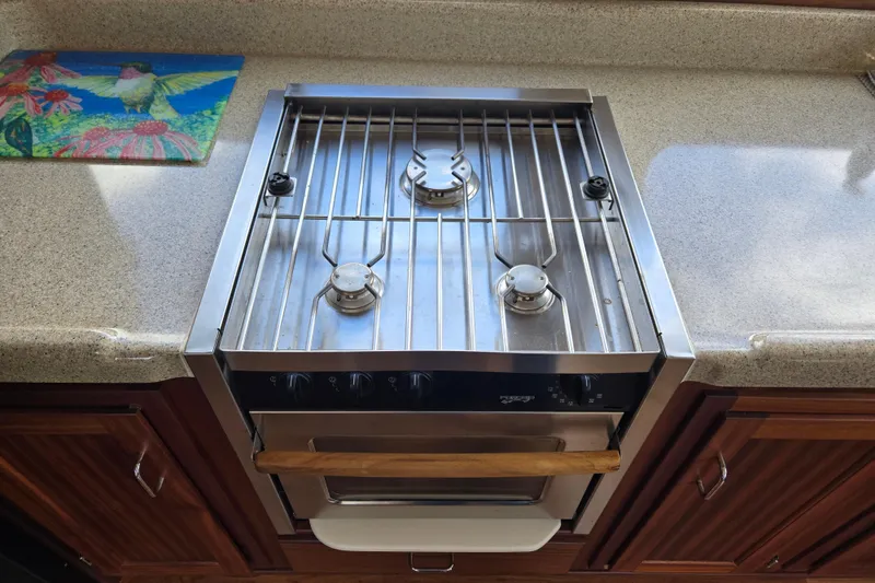 Slide: The Image of Stainless steel stove in 2009 American Tug 34 Rare Flybridge Model kitchen. - 19