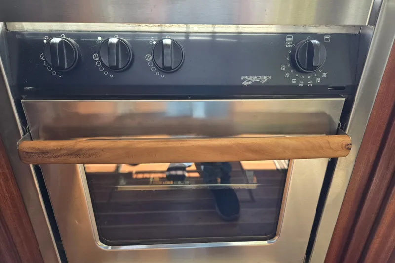 Slide: The Image of Stainless steel oven with wooden handle on 2009 American Tug 34 Flybridge. - 20