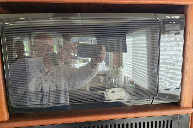 Slide: The Image of Reflection in microwave door on 2009 American Tug 34 Rare Flybridge Model. - 25