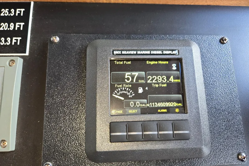 Slide: The Image of American Tug 34 Rare Flybridge Model 2009 marine diesel display showing fuel and engine hours. - 37