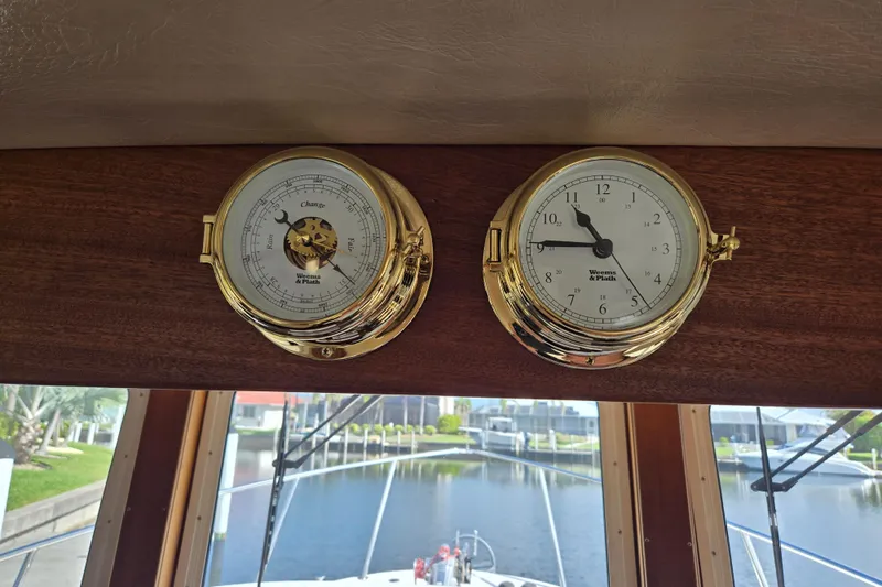 Slide: The Image of Gold nautical instruments on American Tug 34, Rare Flybridge Model, 2009, with marina view. - 39