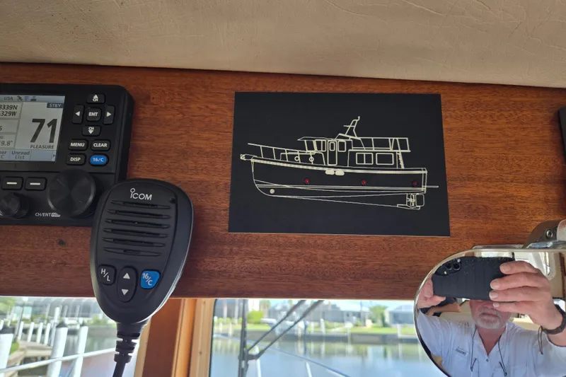 Slide: The Image of 2009 American Tug 34 Rare Flybridge Model interior with navigation equipment and boat sketch. - 41