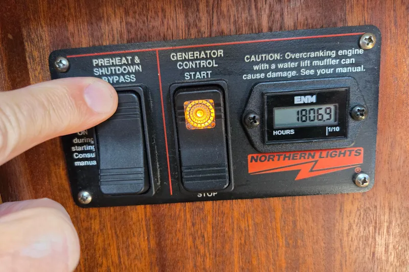 Slide: The Image of Control panel of a 2009 American Tug 34 Rare Flybridge Model with generator start button. - 42